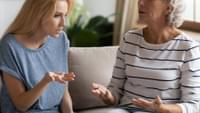Elderly Woman Disagreeing with Young Woman