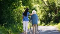 Elderly Woman Outdoors with Carer