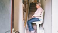 Elderly Woman Using a Stairlift
