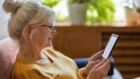 Elderly Woman Using an E Reader