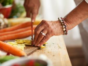 Hands Chopping Vegetables