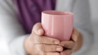 Hands Holding a Mug
