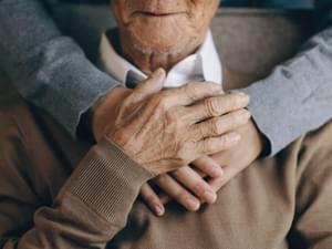 Hugging Elderly Person