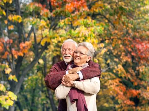 Elderly Couple in Autumn leaves