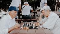 Elderly men playing chess