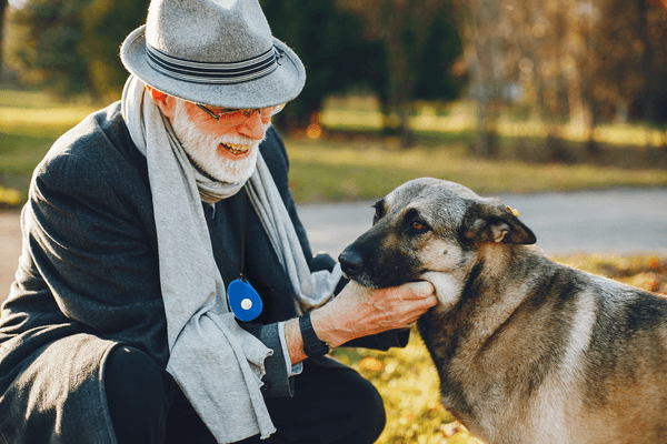 SureSafe Man with Hat and SureSafeGO and Dog