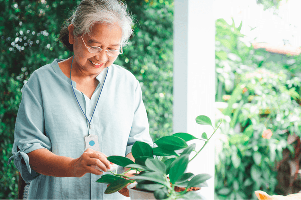 SureSafe Woman Gardening Indoors with Safe Personal Alarm