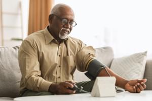 Senior Man Measuring Arterial Blood Pressure