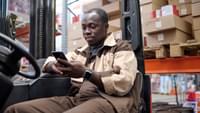 Loader man using mobile phone at work 2022 06 16 20 49 27 utc