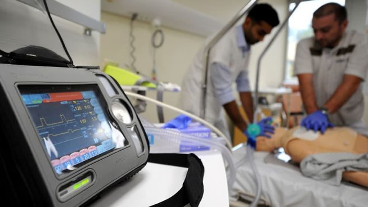 Image of a ventilator being used to treat a critically ill patient.