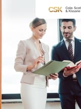 Two law professionals have a conversation, while holding a folder and a book