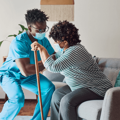 Healthcare worker supports a patient