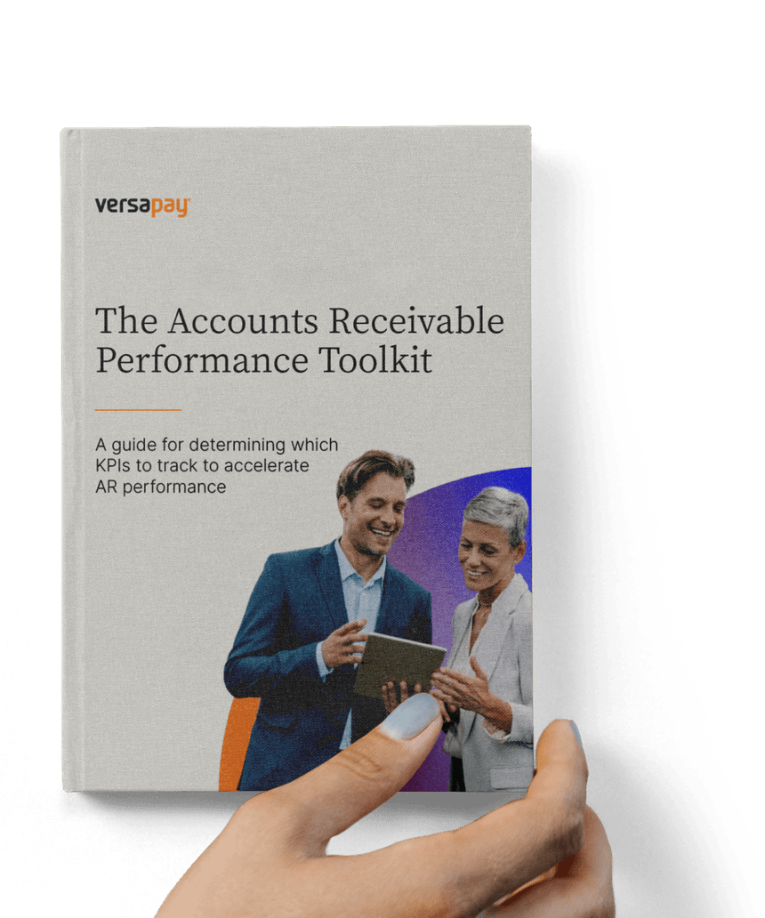 Hand holding the Accounts Receivable Performance Toolkit