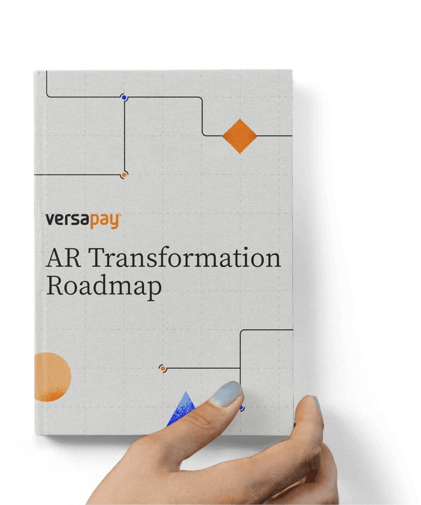 Hand holding the AR Transformation Roadmap report