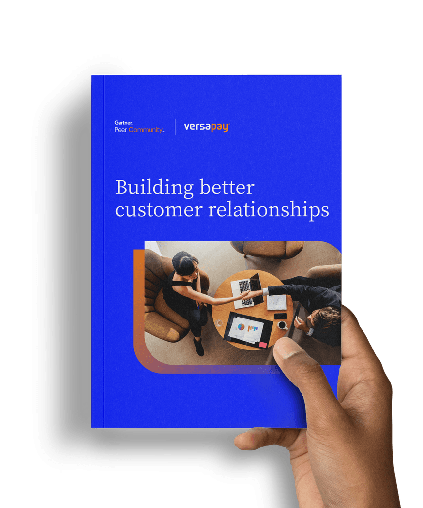 Hand holding the Building Better Customer Relationships report