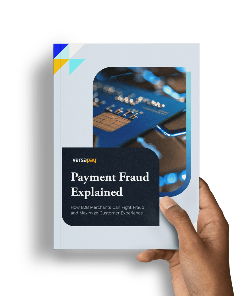 Hand holding the Payment Fraud Explained: How B2B Merchants Can Fight Fraud and Maximize Customer Experience guide