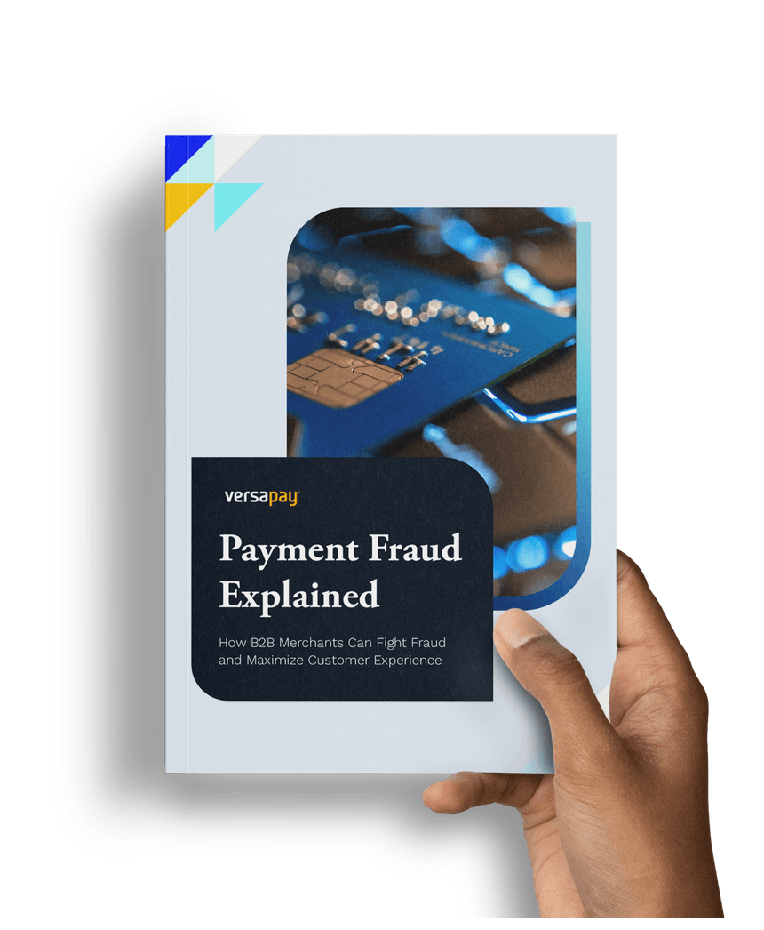 Hand holding the Payment Fraud Explained: How B2B Merchants Can Fight Fraud and Maximize Customer Experience guide