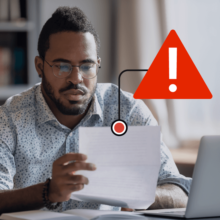 AR professional looks at a sheet of paper; a red warning symbol floats above it