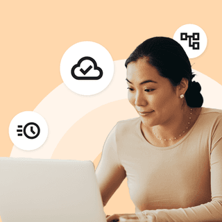 Woman sits at her laptop; she's streamlining her accounts receivable in Microsoft Dynamics 365