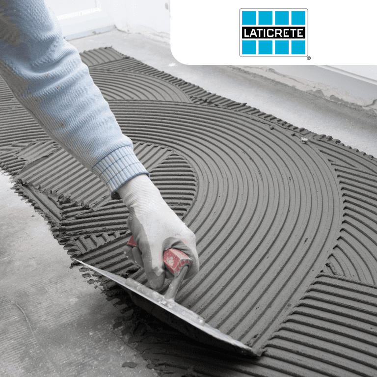 Laticrete case study with Versapay: a person uses a trowel to smooth concrete