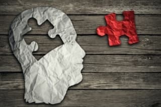 Puzzle Head Brain Concept As A Human Face Profile Made From Crumpled White Paper With A Jigsaw Piece Cut Out On A Rustic Old Wood Background As A Mental Health Symbol