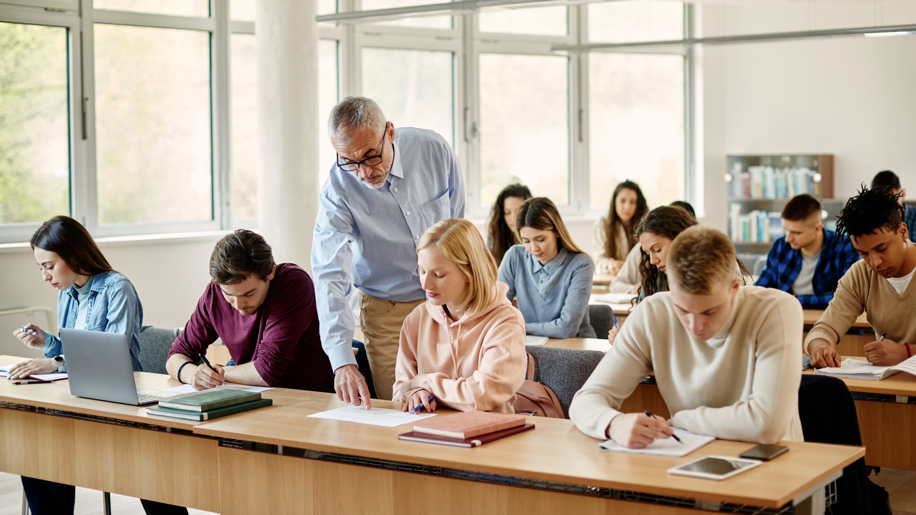 Teacher helping in class