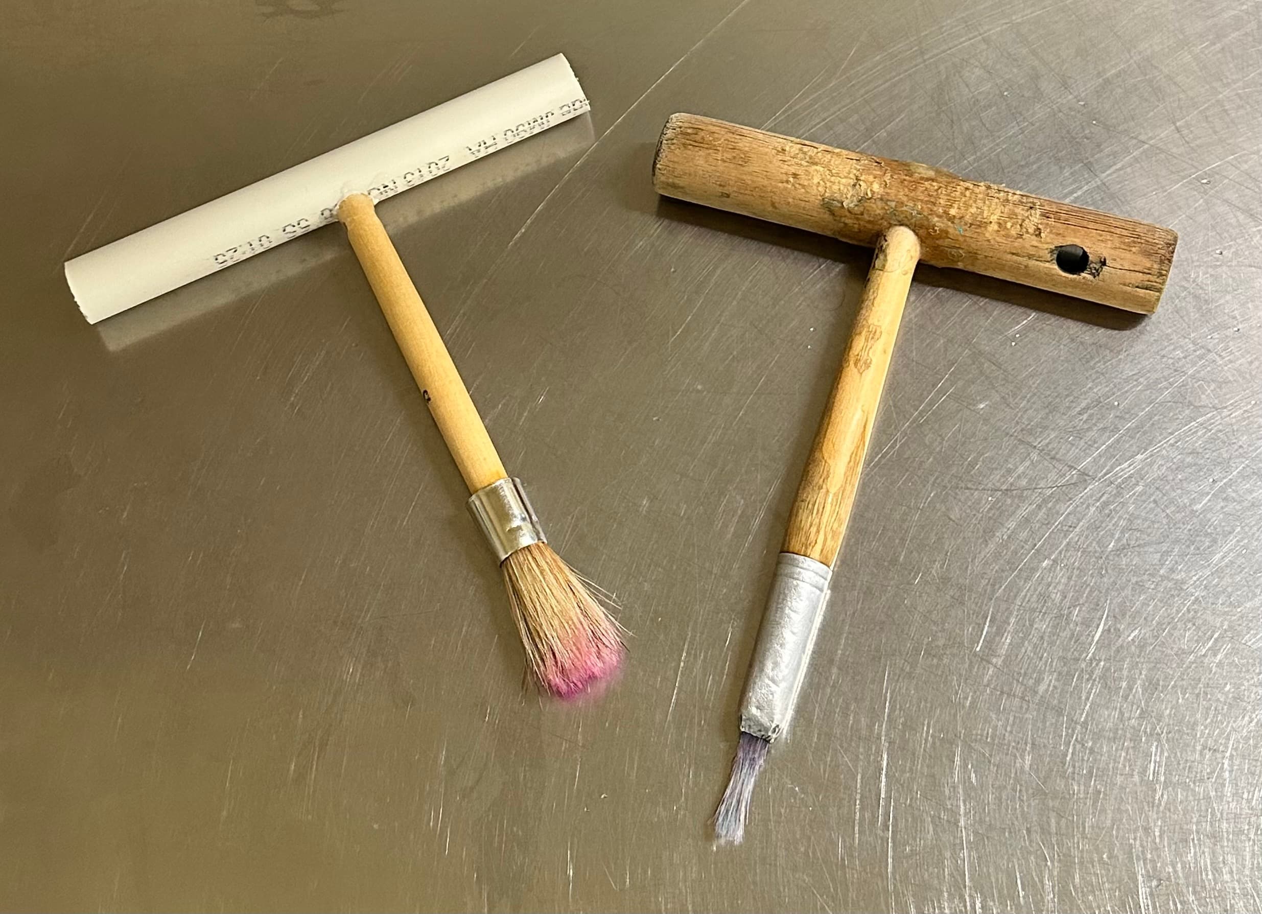 Ella’s PVC paintbrush (L) vs. wooden sea lion paintbrush (R)