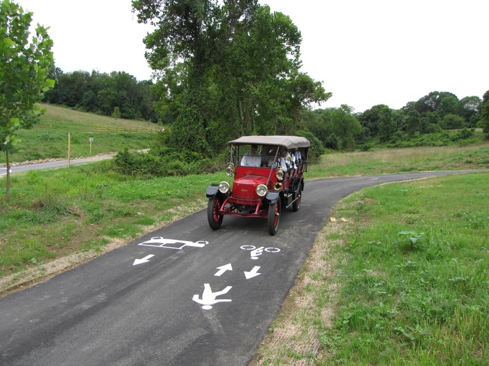 The asphalt trail is marked to remind hikers and bikers to stay to the left on the one-way trail
