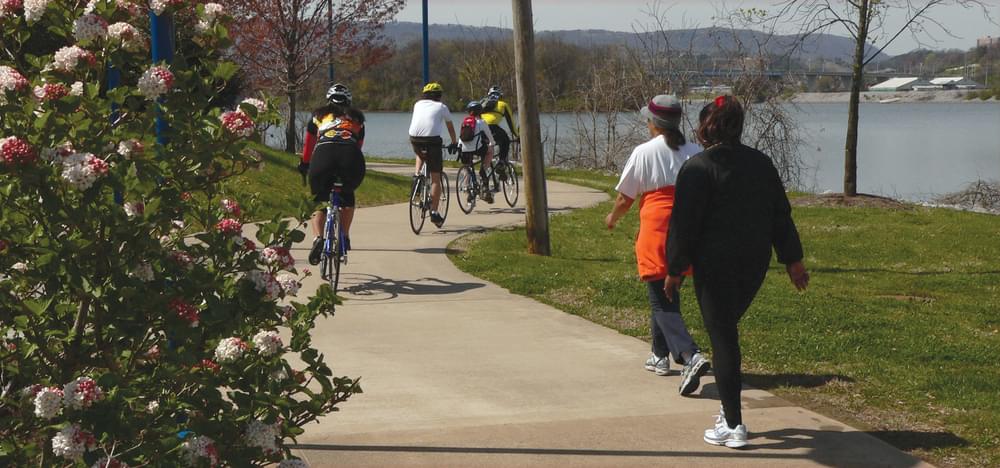 Cyclists and walkers enjoying the trails along the Tennessee River; photo by Stuart Macdonald