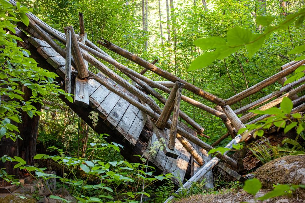 A dilapidated bridge on the North Fork Middle Fork Trail near Oakridge, Oregon. As of 2020 large portions of the 9 mile trail are impassible due to erosion, fallen trees and bridges in need of repair or replacement.