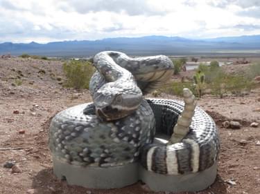 Giant concrete rattlesnake in Bootleg Canyon by the RMLT; photo by Tony Taylor
