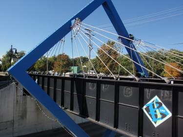 Artistic addition to original steel girder railroad bridge