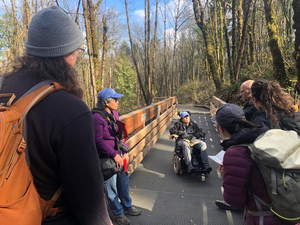 Georgena doing a field training with the Trailkeepers of Oregon at Newell Creek Canyon Nature Park on the Guidelines for Providing Trail Information to People with Disabilities.