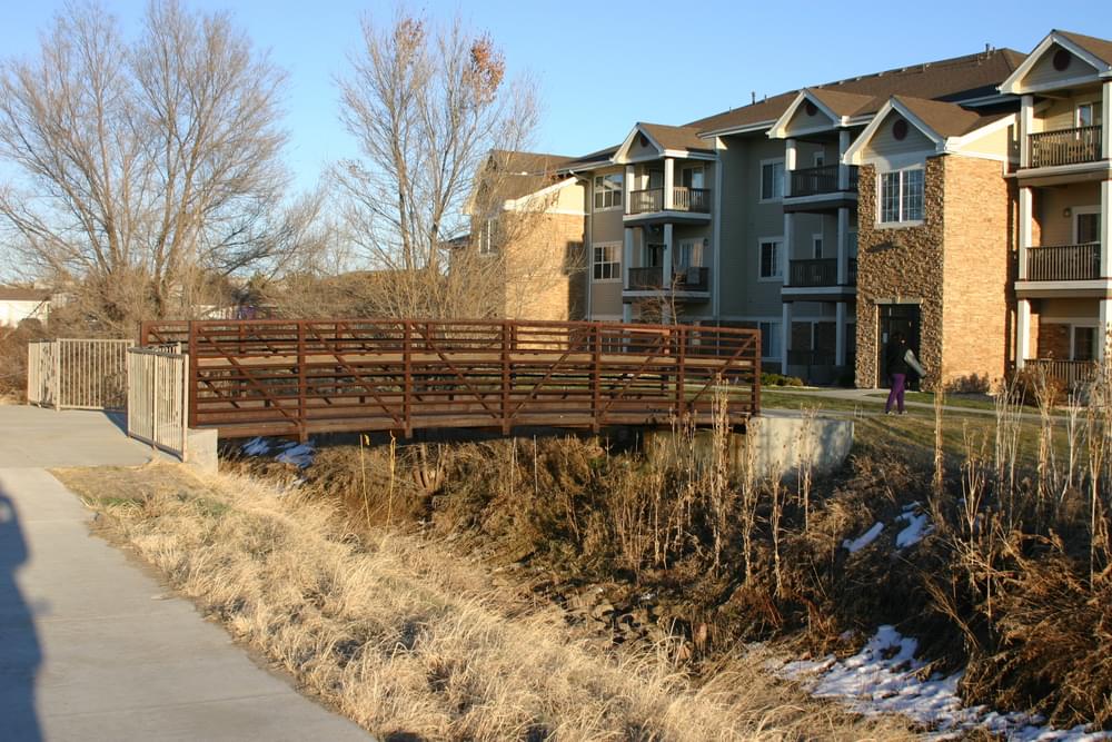 This bridge was built for new multi-housing to access the Highline Canal Trail in Aurora, Colorado. No fences anywhere!