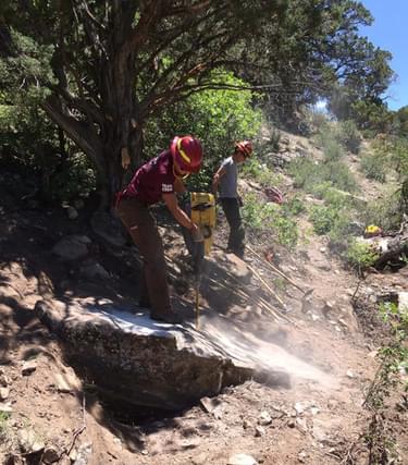 U.S. Forest Service Trails Unlimited Team removing rock outcrops