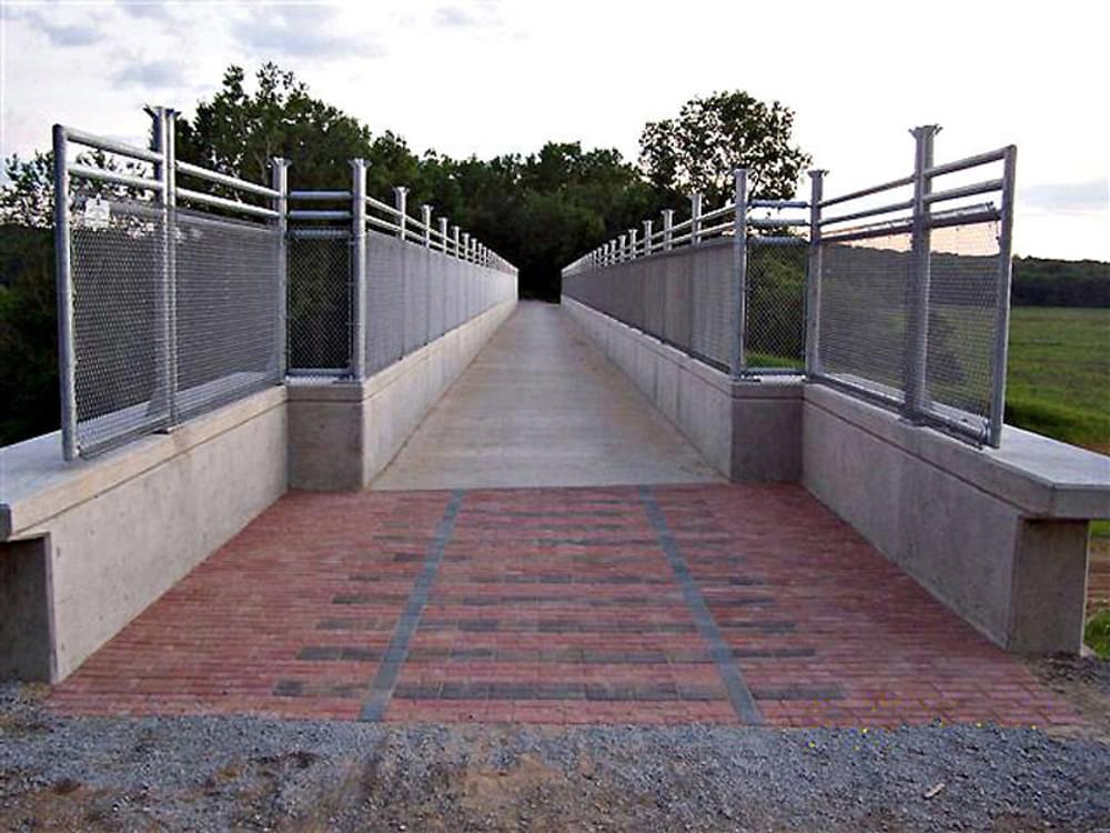 Cedar View Trail bridge. Completed pavers remind trail users of railroad history of this particular trail corridor; Artist Judy Bales