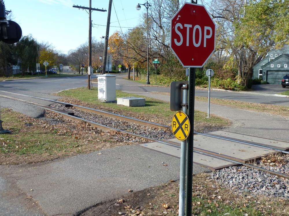 Highway railroad crossing signals also warn trail users; Minneapolis Cedar Lake Regional Trail