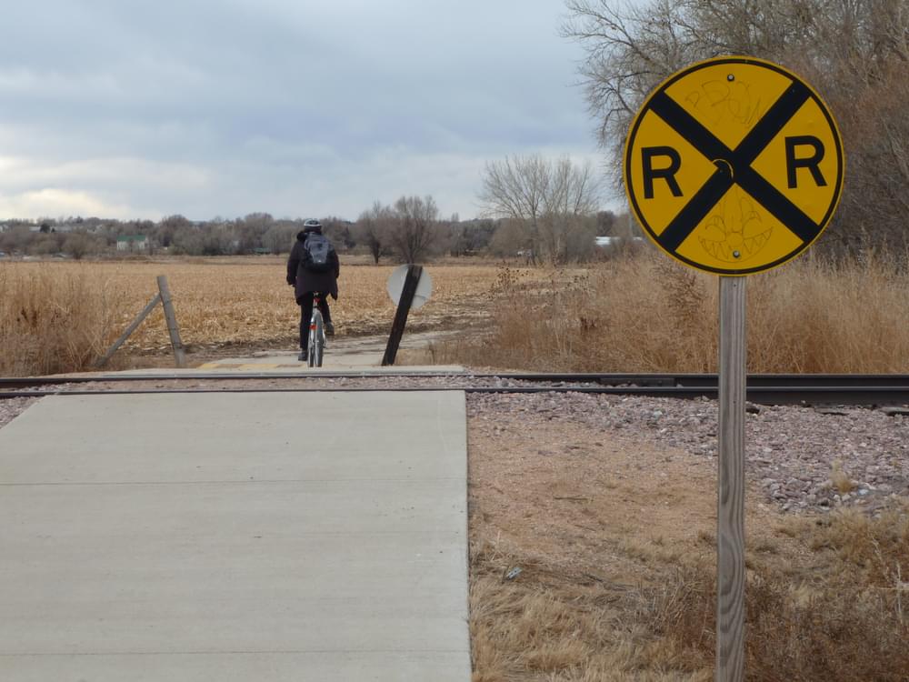 Rural railroad crossing on Poudre River Trail west of Fort Collins, Colorado