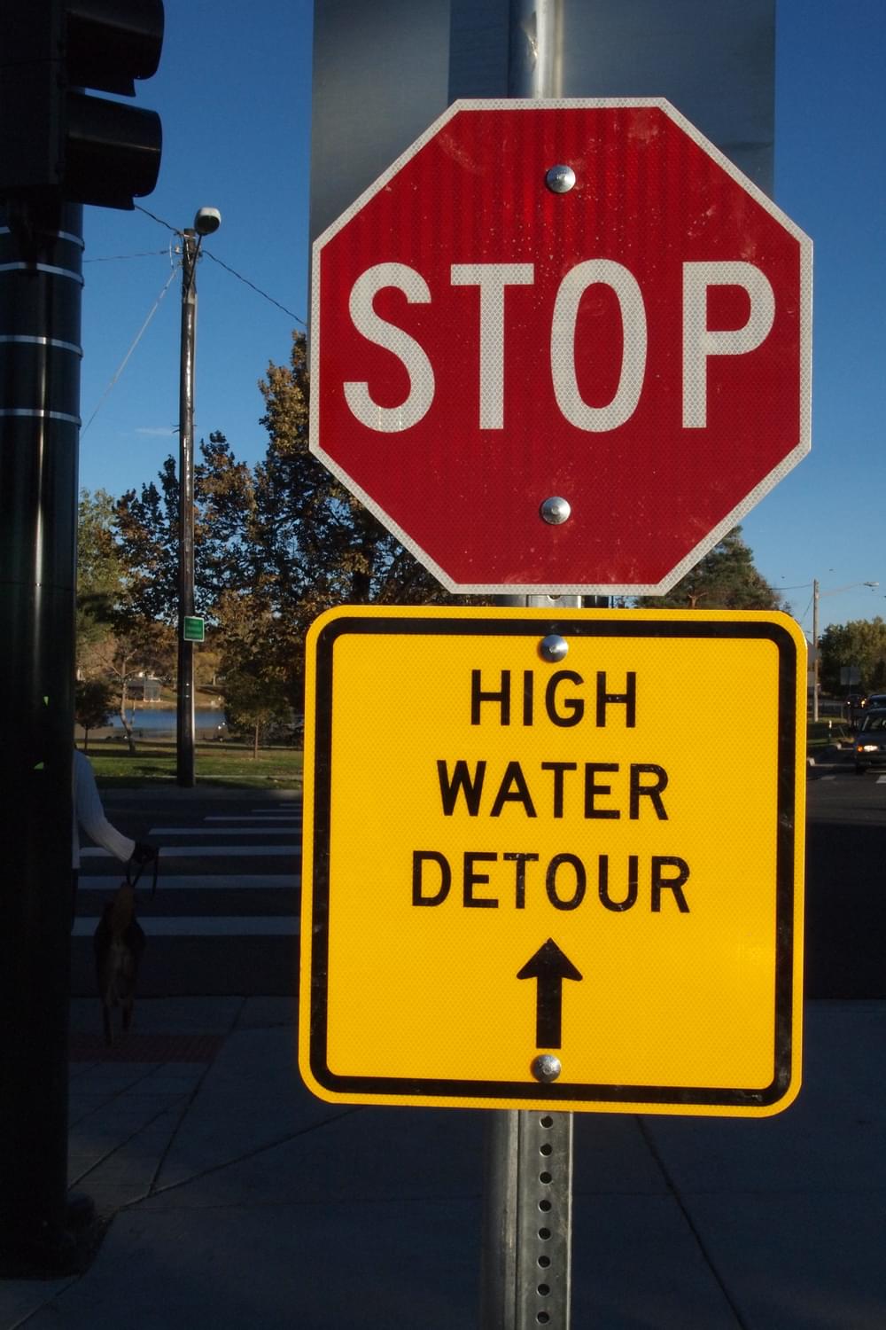 Stop sign combined with high water detour sign; Cherry Creek Trail in Denver 