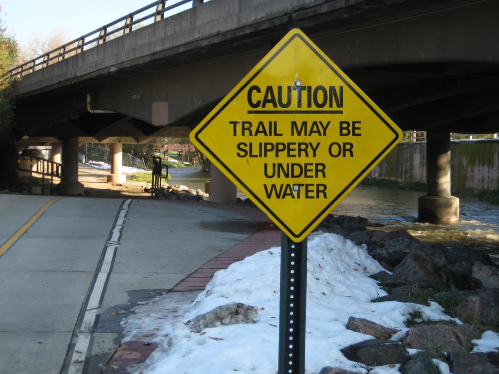 The trail along this channelized section of Cherry Creek must also pass under a road bridge; Denver, Colorado