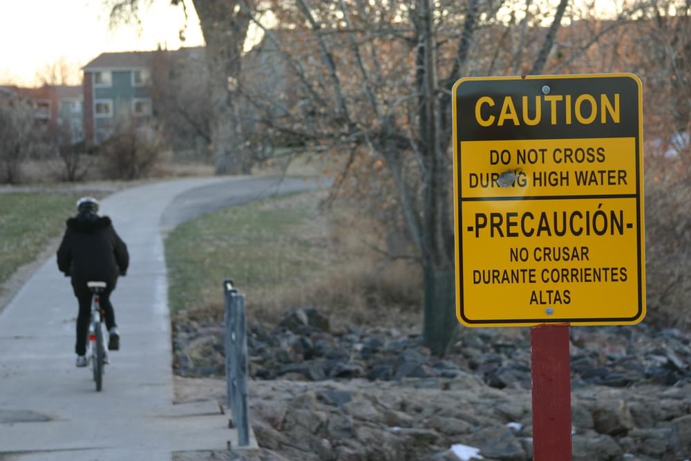 A side drainage is subject to flooding along Highline Canal in Aurora, Colorado