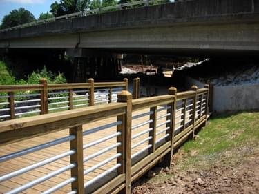Finished bridge and underpass in use on the trail