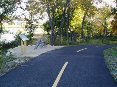 The Graber Pond Trail features porous asphalt that reduces surface water runoff