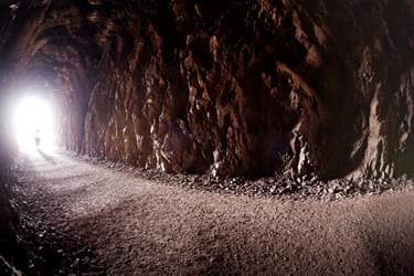 Detail of the crushed rock surface inside one of the five tunnels along the trail. Photo by Andrew Cattoir for the National Park Service, Lake Mead National Recreation Area