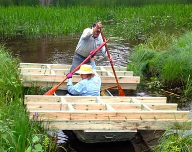Moving Boardwalk Frames by Boat; photo by Dave Caliebe