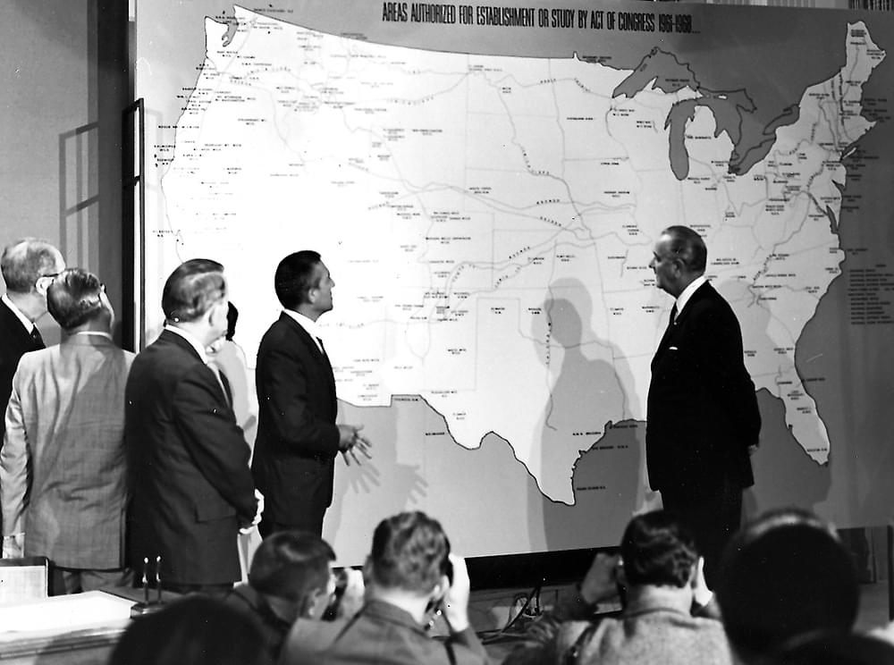 President Lyndon Johnson with a map of the new National Trails System.