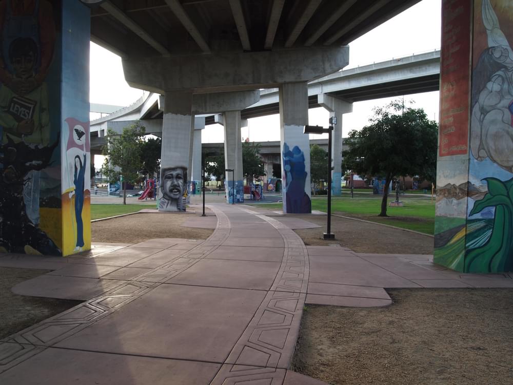 Murals on freeway piers along trail through San Diego’s Chicano Park