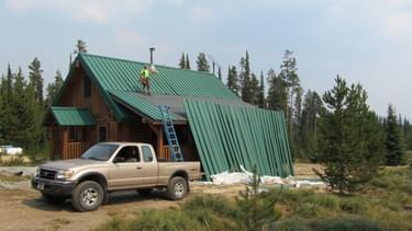 Repairing the roof on the Gorden Reese Cabin