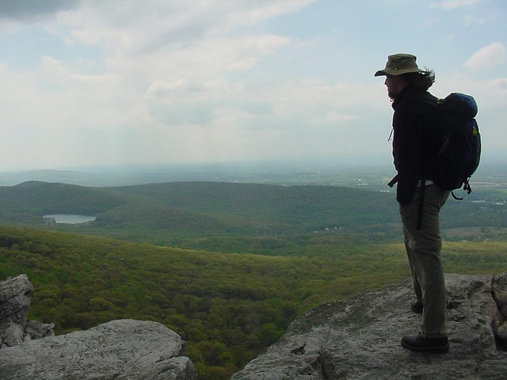 Hiker enjoying the view at the Annapolis Rock Hiker Campground and Trail in South Mountain State Park, Maryland