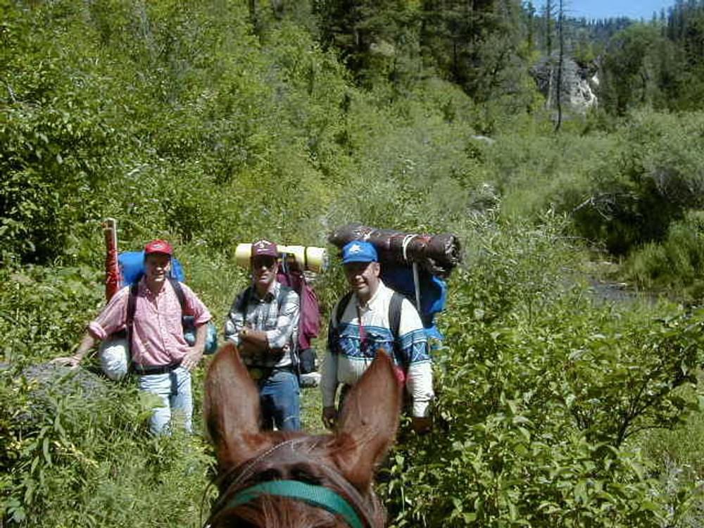 A group of overnight hikers at the Palisades Lower Lake meets a horseman on the Palisades Creek National Recreation Trail